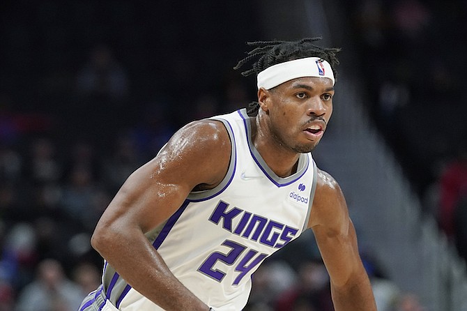 Sacramento Kings guard Buddy Hield runs up court during the first half of an NBA basketball game against the Detroit Pistons, Monday, Nov. 15, 2021, in Detroit. (AP Photo/Carlos Osorio)