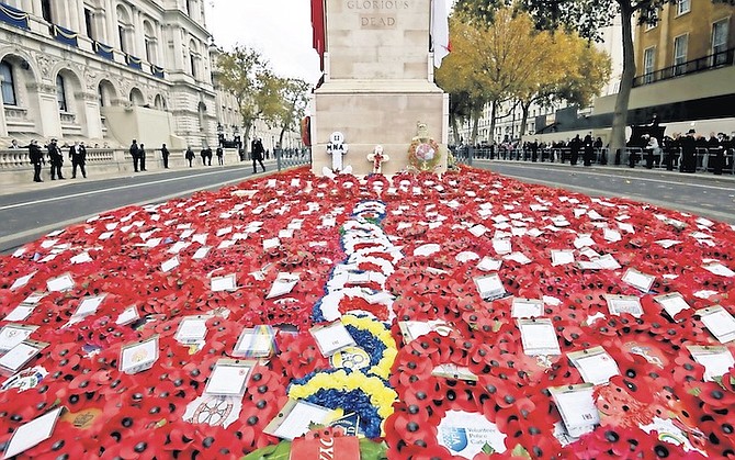 Poppy wreaths placed during the Remembrance Sunday service at the Cenotaph, in Whitehall, London, Sunday. 
(Toby Melville/Pool via AP)