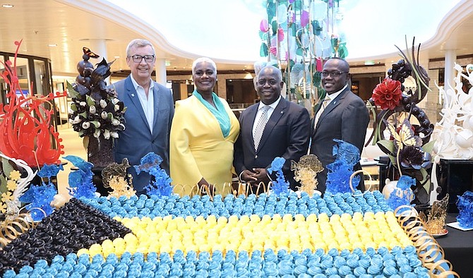 ROYAL Caribbean CEO Michael Bayley, Erin Brown, Prime Minister Philip Davis and Deputy Prime Minister Chester Cooper on board Royal Caribbean’s newest ship, Odyssey of the Seas, yesterday. The vessel is the first quantum ultra-class ship in North America. Photo: Racardo Thomas/Tribune staff