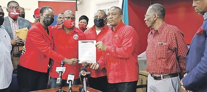 MARCO City MP Michael Pintard (centre left) with his nomination form. Photo: Racardo Thomas/Tribune staff