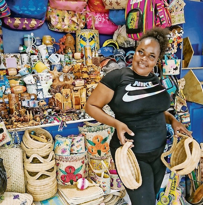 A VENDOR at the Straw Market yesterday, which reopened after 22 months of closure due to the
COVID-19 pandemiuc. Photo: Racardo Thomas/Tribune Staff
