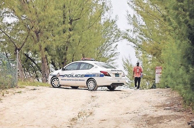 POLICE at the scene last year after Cabbage Beach vendors discovered the entrance locked and their items relocated.
Photo: Donavan McIntosh/Tribune Staff