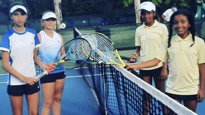 GOOD EFFORT: Shown at far right are Team Bahamas members Kaylah Fox and Briana Houlgrave at the ITF/COTECC 12U Team Finals competition in Santo Domingo, The Dominican Republic, yesterday.