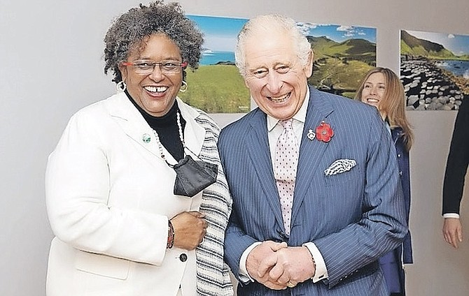 BRITAIN’S PRINCE CHARLES, right, greeting Barbados’ Prime Minister Mia Mottley during the COP26 summit in Glasgow on November 1. Photo: Jane Barlow/Pool Photo via AP