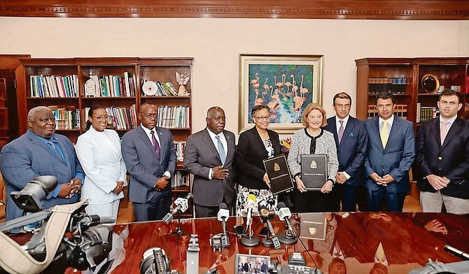 THE HEADS of Agreement ceremony as Prime Minister Philip “Brave” Davis and Deputy Prime Minister Chester Cooper are pictured with Cotton Bay executives. Photos: Donavan McIntosh/Tribune Staff