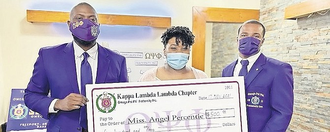 OMEGA Psi Phi Fraternity Inc Kappa Lambda Lambda Chapter in Freeport awarded Angel Percentie, a student at Bishop Michael Eldon High School, a scholarship for winning its annual essay competition. From left, NT Knowles, chapter president, Angel Percentie, and Remmington Wilchcombe, keeper of records and seal.