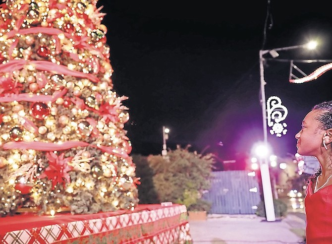 SINGER Samantha Sands with the Christmas tree in Rawson Square.