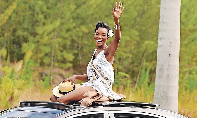 Miss Universe Bahamas Chantel O’Brian waves from her motorcade as she returns home after reaching the top ten of the Miss Universe competition. 
Photo: Donavan McIntosh/Tribune Staff