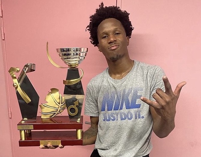 DOMINICK Bridgewater shows off his trophy after he helped his Sapela Basket 13 club to the Coupe de Provence title in France’s NM2 League. Bridgewater finished with 17 points and six assists in his team’s 77-65 win over HTV yesterday.