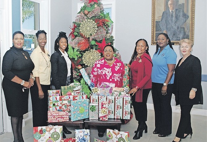 MEMBERS of FIDA are seen making a donation at the Rand on Friday. From left are FIDA members Clara Cleare, Charisse Brown, director; Rosanne Sweeting, vice president; Jethlyn Burrows, president; Sharon A Williams, hospital administrator; Hadassah Swain, community and social outreach committee chairperson, and Rengin Johnson, member.