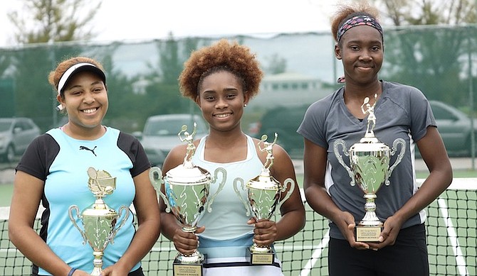TROPHY FEVER: Shown, from left to right, are Sierra Donaldson, champion Sydney Clarke and runner-up Elana Mackey with their trophies after Clarke emerged as the BLTA’s 2021 Giorgio Baldacci Open Nationals women’s champion. She earned a 6-2, 6-0 win over Mackey yesterday at the National Tennis Centre. 
Photo: Racardo Thomas/Tribune Staff