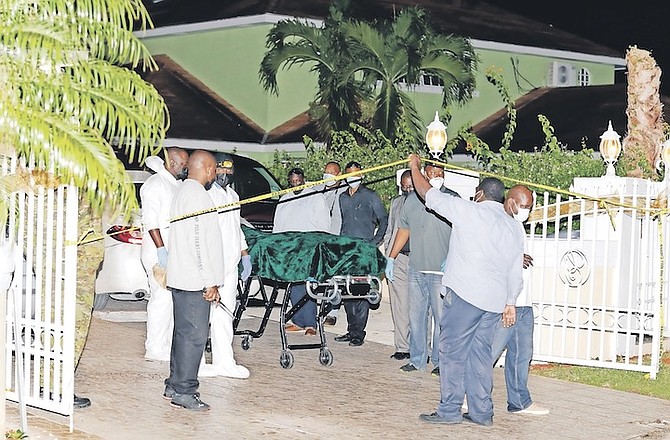 THE BODY of Leon Griffin is removed from the scene last night. Photos: Donavan McIntosh/Tribune Staff