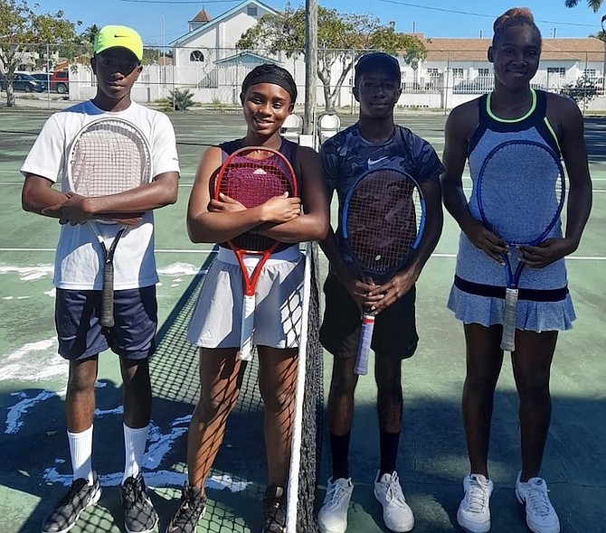 SHOWN, from left to right, are Michael Butler Jr with exhibition players Sydney Clarke, Sharano Hanna and Elana Mackey.