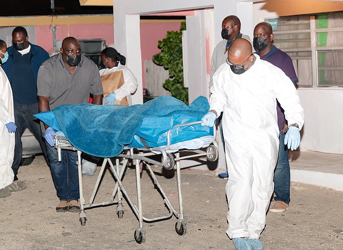 THE VICTIM’S body is removed from the scene of the shooting in Coconut Grove. 
PHOTOS: Donavan McIntosh/Tribune staff