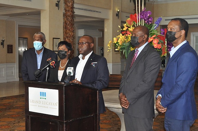 Deputy Prime Minister Chester Cooper, with Minister for Grand Bahama Ginger Moxey, speaking at the Grand Lucayan yesterday. Photos: Vandyke Hepburn