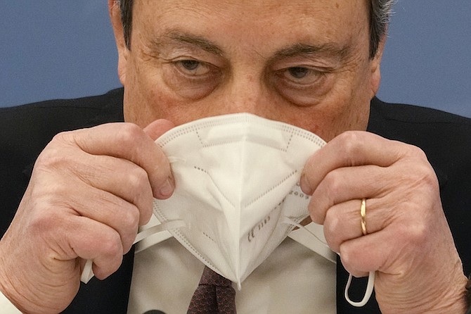 ITALIAN Premier Mario Draghi wears his face mask during a press conference to explain the Government’s new anti-COVID 19 measures in Rome on Monday. Photo: Gregorio Borgia/AP