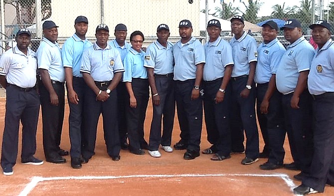 THE LATE umpire Brent Spence is pictured fourth from left. Spence passed away on Thursday in Grand Bahama where he was a mechanical technician at the Freeport Container Port.