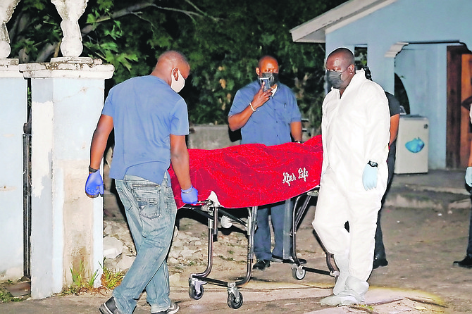 A body is taken from the scene last night. 
Photo: Donavan McIntosh/Tribune Staff