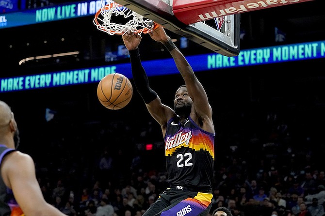 PHOENIX Suns centre Deandre Ayton (22) dunks against the Brooklyn Nets during the second half of an NBA basketball game on Tuesday night in Phoenix. The Suns defeated the Nets 121-111.
(AP Photo/Matt York)