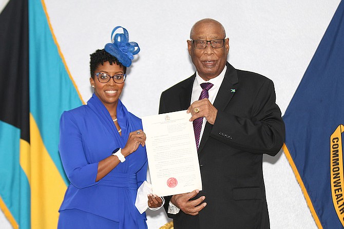 Michela Barnett-Ellis was presented her Instrument and Letter of Appointment to the Senate by Governor General Sir Cornelius A. Smith during a brief ceremony at Paul Farquharson Centre, Police Headquarters, on Friday. Also in attendance was Leader of the Opposition Michael Pintard. 
(BIS Photos/Letisha Henderson)