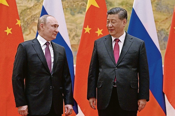 CHINESE President Xi Jinping, right, and Russian President Vladimir Putin talk to each other during their meeting in Beijing, China, last Friday. 
Photo: Alexei Druzhinin, Sputnik/ Kremlin Pool Photo via AP