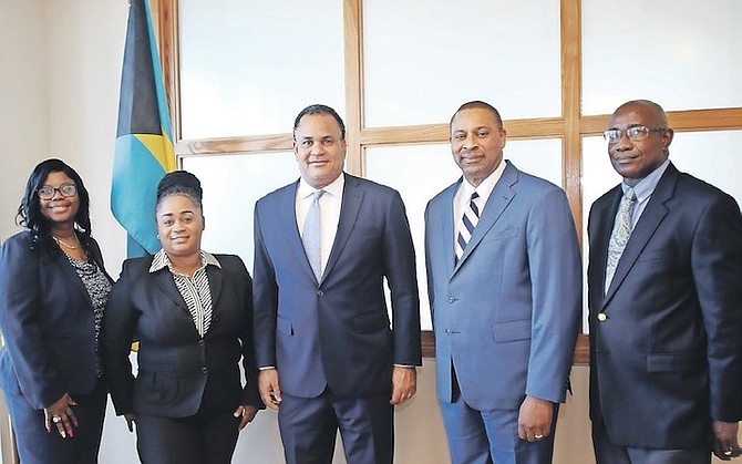 Senator Michael Halkitis, minister of economic affairs (centre), meets members of the Consumer Protection Commission (CPC) yesterday.  Pictured from L to R are: Roselyn Miller; Shantell Butler; Mr Halkitis; commissioner Walter Ferguson; and Neno Newbold.
Photo: Patrick Hanna/BIS