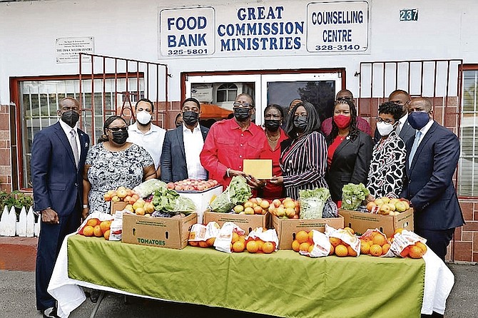 MEMBERS of the Senate make a presentation to Great Commission Ministries on Wulff Road yesterday. Photos: Racardo Thomas/Tribune Staff