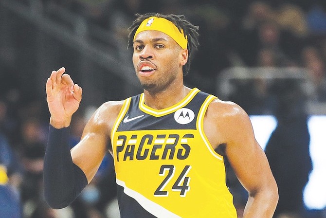 INDIANA Pacers’ Chavano “Buddy” Hield gestures after making a shot during the first half of an NBA basketball game against the Milwaukee Bucks last night in Milwaukee. He scored a season-high 36 points. 
(AP Photo/Aaron Gash)
