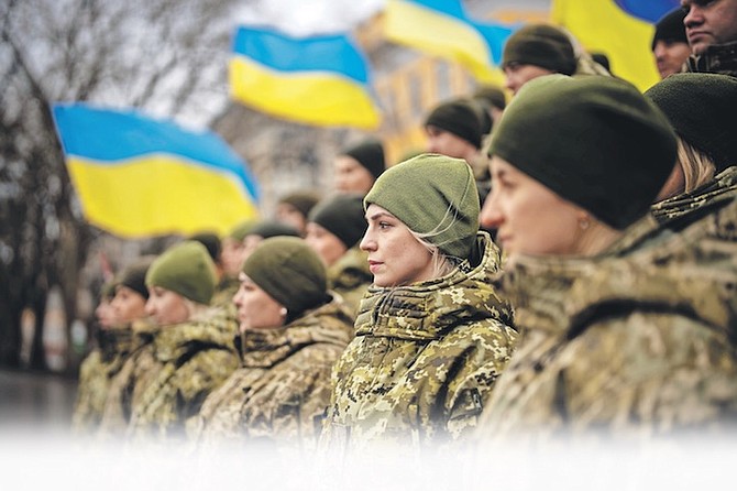UKRAINIAN Army soldiers at a Day of Unity in Odessa, Ukraine, yesterday. 
Photo: Emilio Morenatti/AP