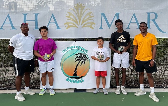 ISLAND Tennis Bahamas coaches Philip Major Jr and Oneil Mortimer with winners Khai and Kingston Rees and Dentry Mortimer Jr.