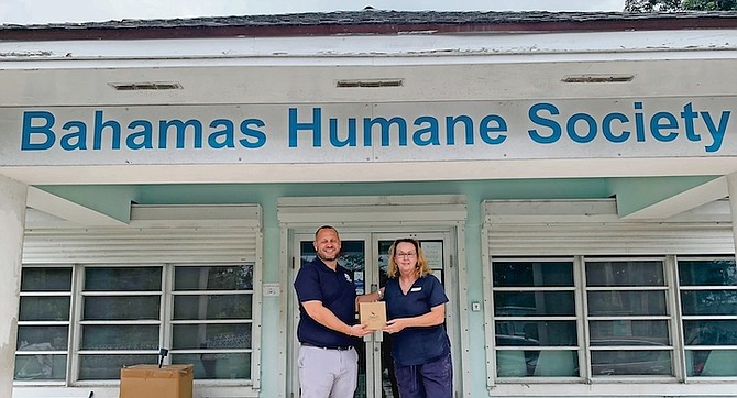 JOHN Cancino and Fiona Fraser at the Bahamas Humane Society after the Amoury Company helped to provide security cameras.