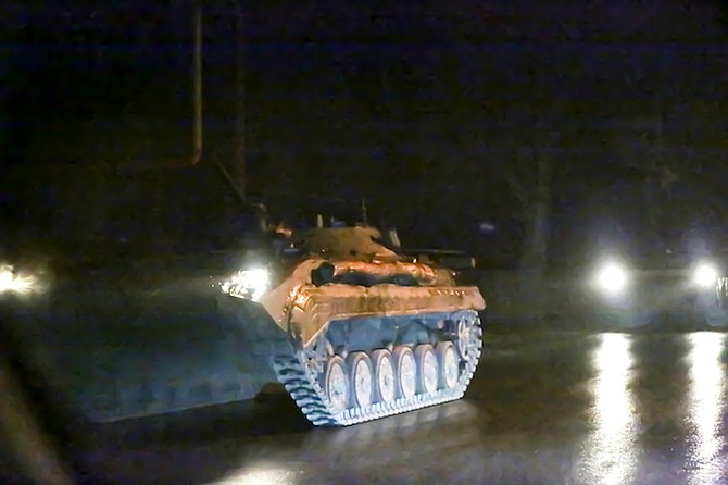 An armoured vehicle rolls down a street outside Donetsk, the territory controlled by pro-Russian militants, eastern Ukraine, late Tuesday. (AP Photo)