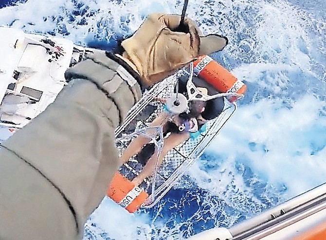 A 51-year-old man is winched to safety by the United States Coast Guard on Monday after being bitten by a shark while fishing aboard a vessel near Bimini.
Photo: United States Coast Guard