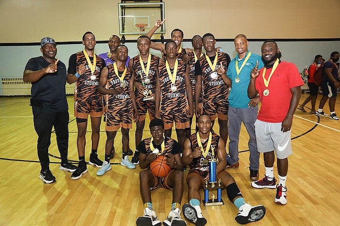 WE ARE THE CHAMPIONS: Providence Storm were a little too much for Island Dreams to handle down the stretch in the boys’ under-18 championship game in the Providence Basketball Club’s Mid-Term Break Classic on Monday night. The classic, played at the CI Gibson Gymnasium, took the place of the prestigious Hugh Campbell Basketball Classic, which was called off for the third consecutive year due to the COVID-19 pandemic and the inactivity of high school sports. 
Photo: Racardo Thomas/Tribune Staff