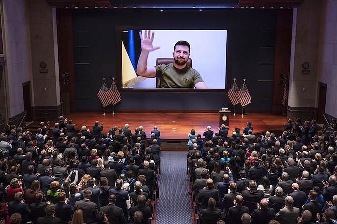 UKRAINIAN President Volodymyr Zelenskyy speaks to the U.S. Congress by video to plead for support as his country is besieged by Russian forces, at the Capitol in Washington, Wednesday. 
(AP Photo/J. Scott Applewhite, Pool)