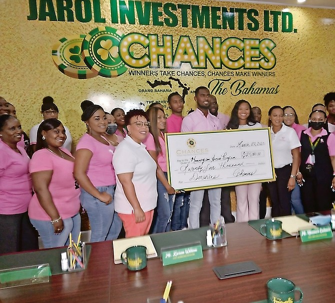 JAROL Investment Ltd presented a cheque for $25,000 to Mammogram Access Program (MAP) to assist with the purchase of a mammogram machine for breast cancer screening on Grand Bahama. Nikia Watson, founder of MAP (standing to the right of cheque) is pictured accepting the donation on Tuesday at Jarol headquarters in Freeport. Photo: Denise Maycock/Tribune Staff