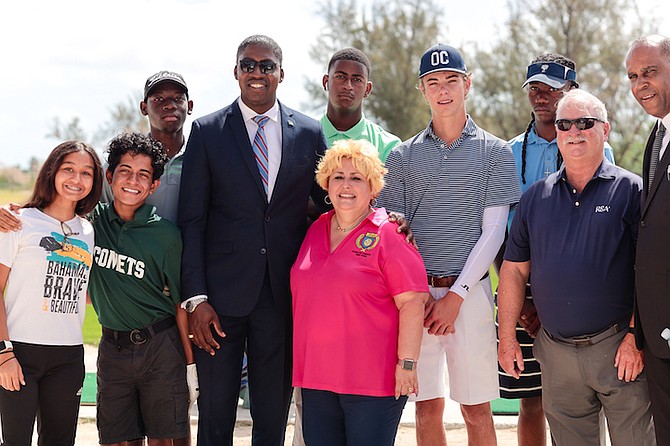 MINISTER of State for Education Zane Lightbourne and BGF’s Junior Golf Director Gina Rolle-Gonzalez, are joined by some of the top high school golf players at the BGF’s Golf Club and Driving Range at the Baillou Hills Sporting Complex. 
Photo: Donavan McIntosh/Tribune Staff