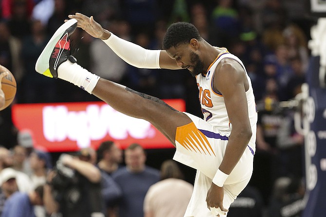 PHOENIX Suns centre Deandre Ayton warms up before an NBA basketball game against the Minnesota
Timberwolves on Wednesday in Minneapolis.
(AP Photo/Andy Clayton-King)