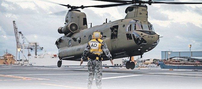 HMAS Adelaide embarks Chinook Heavy-Lift Helicopters, in January before departing Australia to provide humanitarian assistance to Tonga after a volcanic eruption.