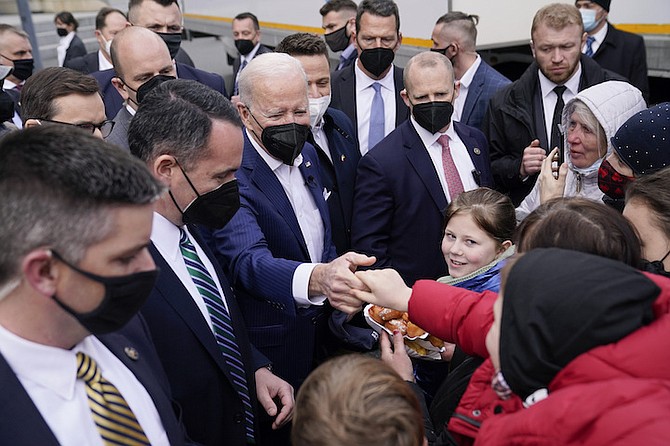 PRESIDENT Joe Biden meets with Ukrainian refugees and humanitarian aid workers during a visit to PGE Narodowy Stadium, in Warsaw, Saturday.
(AP Photo/Evan Vucci)