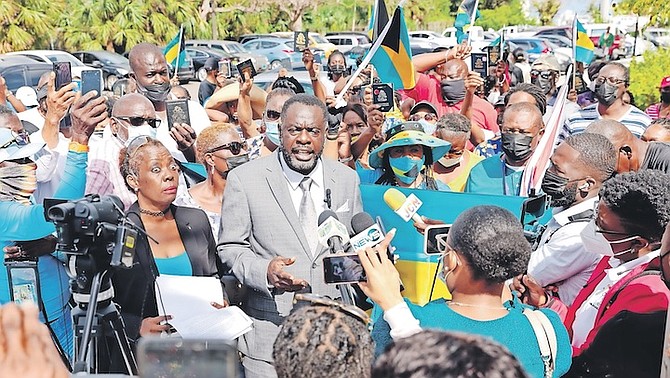 LINCOLN Bain outside the Office of the Prime Minister with a protest group threatening to take legal action against the government. Photo: Donavan McIntosh/Tribune Staff