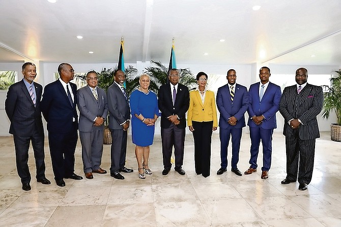 MINISTER of Foreign Affairs Fred Mitchell and Ann Marie Davis, the wife of Prime Minister Philip “Brave” Davis, with appointees, from left, Leon Williams, Al Dilette, Damian Gomez, Winston Pinnock, Hope Strachan, Jamaal Rolle (second from right) and Ron Pinder (far right). Photo: Racardo Thomas/Tribune Staff