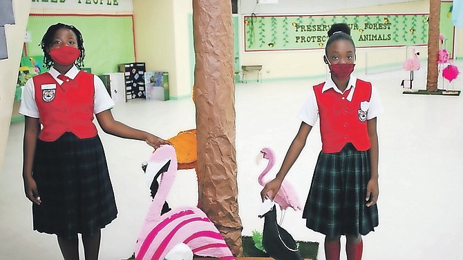 DESTINY Wilson and Phillea Strachan are pictured with some of the animals created by students of Uriah McPhee Primary School.
Photos: Patrick Hanna/BIS
