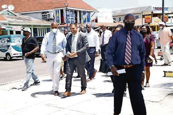 MINISTER of Agriculture, Marine Resources and Family Island Affairs Clay Sweeting and Minister of Works and Utilities Alfred Sears touring Arawak Cay yesterday.
Photo: Racardo Thomas/Tribune Staff