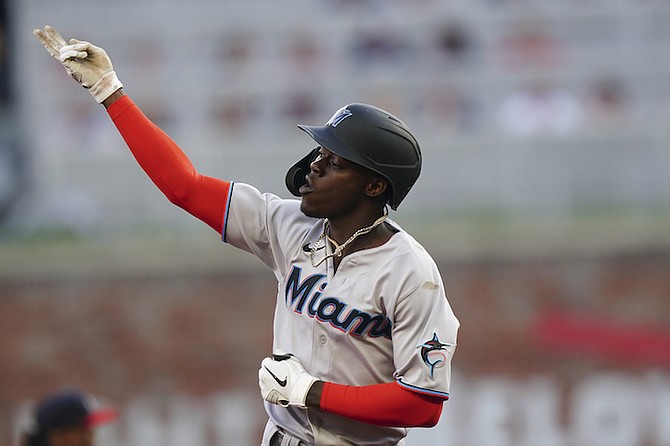 MARLINS’ Jazz Chisholm Jr gestures as he runs the bases after hitting a solo home run during the first inning against the Atlanta Braves on Saturday in Atlanta. 
(AP Photo/John Bazemore)