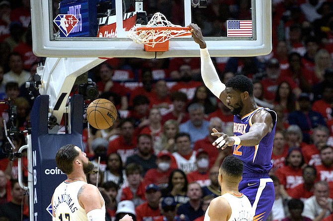 DEANDRE Ayton dunks against the Pelicans in Game 4 of his first-round playoff series in New Orleans Sunday. 
(AP Photo/Matthew Hinton)