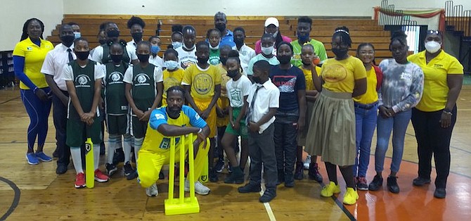 COREY EDWARDS, Bahamas Cricket Association development officer, poses with primary and junior high school students and physical education teachers. He says while the cricket programme is just in its infancy stage, he anticipates that it will grow bigger and better as they seek to get more Bahamians playing the sport once again.
