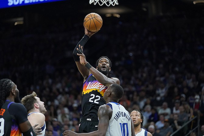 Phoenix Suns centre Deandre Ayton (22) shoots over Dallas Mavericks forward Dorian Finney-Smith (10) during the second half of Game 1 in the second round of the NBA Western Conference playoff series Monday in Phoenix. (AP Photo/Matt York)
