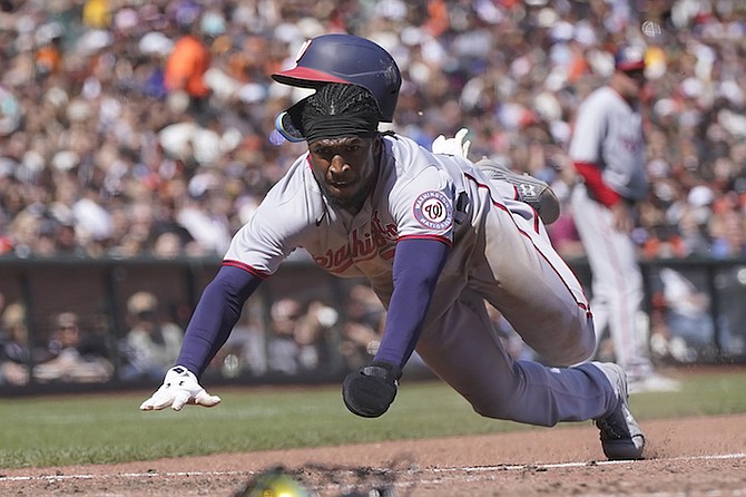 WASHINGTON Nationals’ Lucius Fox, of The Bahamas, slides home to score against the San Francisco Giants during the sixth inning of a baseball game in San Francisco on Sunday. 
(AP Photo/Jeff Chiu)