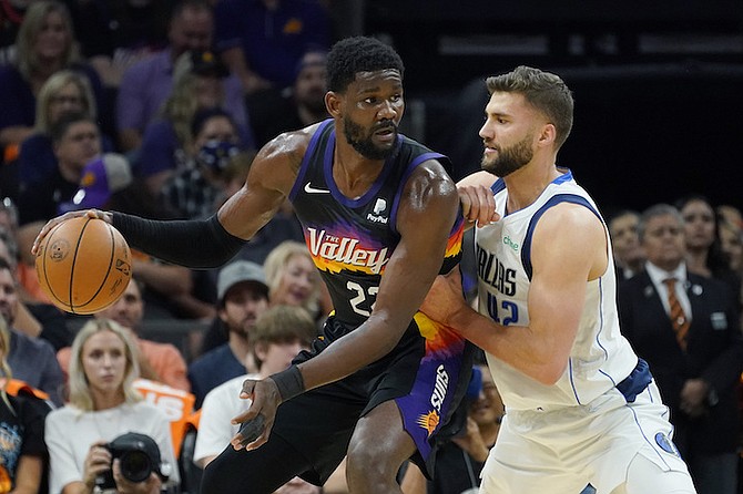 Phoenix Suns centre Deandre Ayton (22) drives the ball against Dallas Mavericks forward Maxi Kleber (42) during the first half of Game 2 in the second round of the NBA Western Conference playoff series Wednesday, May 4, 2022, in Phoenix. (AP Photo/Matt York)